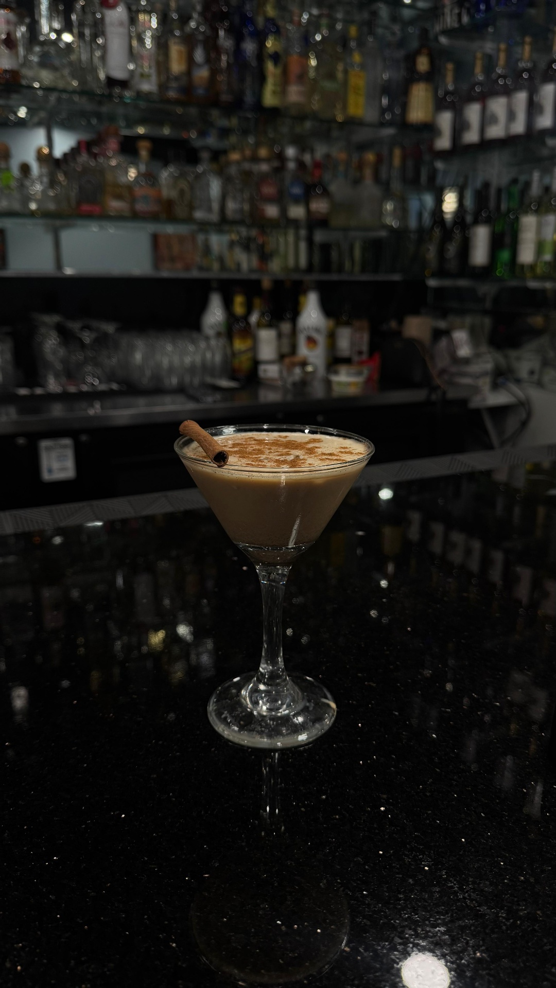 Signature homemade chai martini topped with cinnamon at Bawarchi's bar